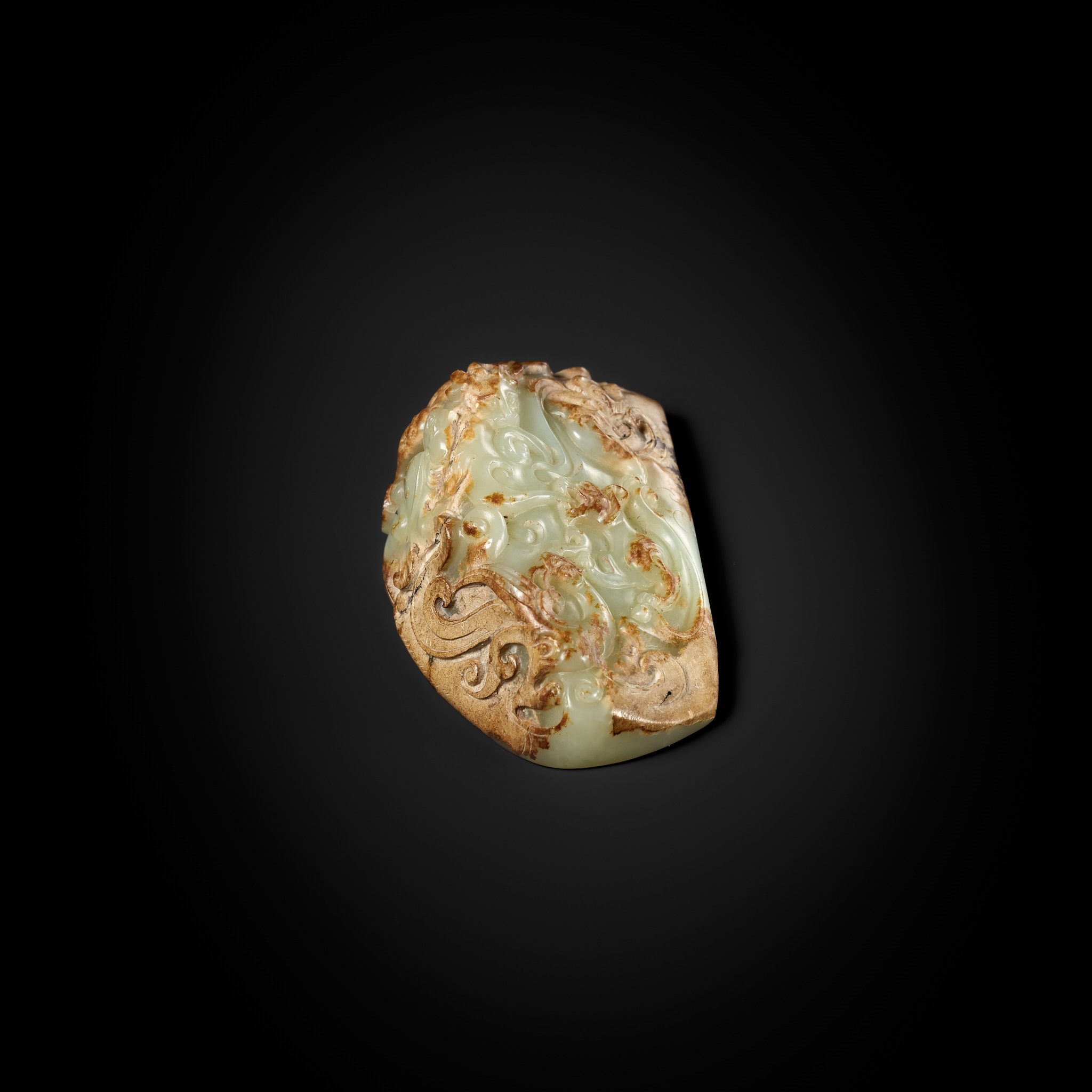 Han Dynasty | A CELADON AND RUSSET JADE ‘FOUR GUARDIANS’ WEIGHT ...
