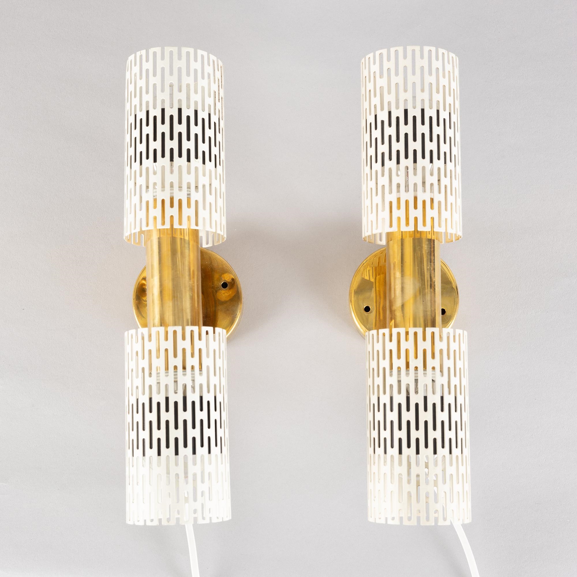 Artwork by Harald Notini, a pair of wall lamps model "8820", Arvid Böhlmarks Lampfabrik, Stockholm, 1940s-50s, Made of glass, wood and leather
