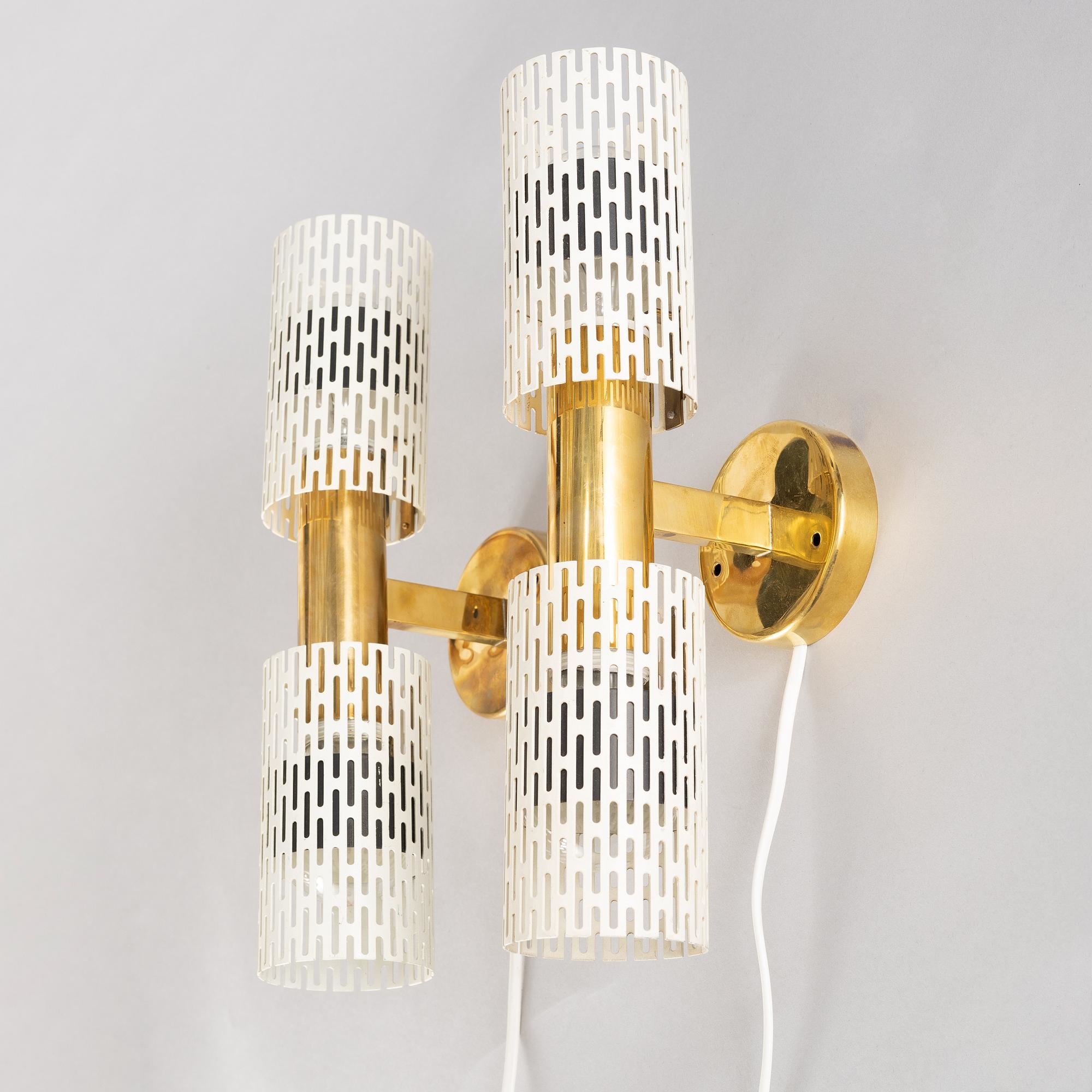 Artwork by Harald Notini, a pair of wall lamps model "8820", Arvid Böhlmarks Lampfabrik, Stockholm, 1940s-50s, Made of glass, wood and leather