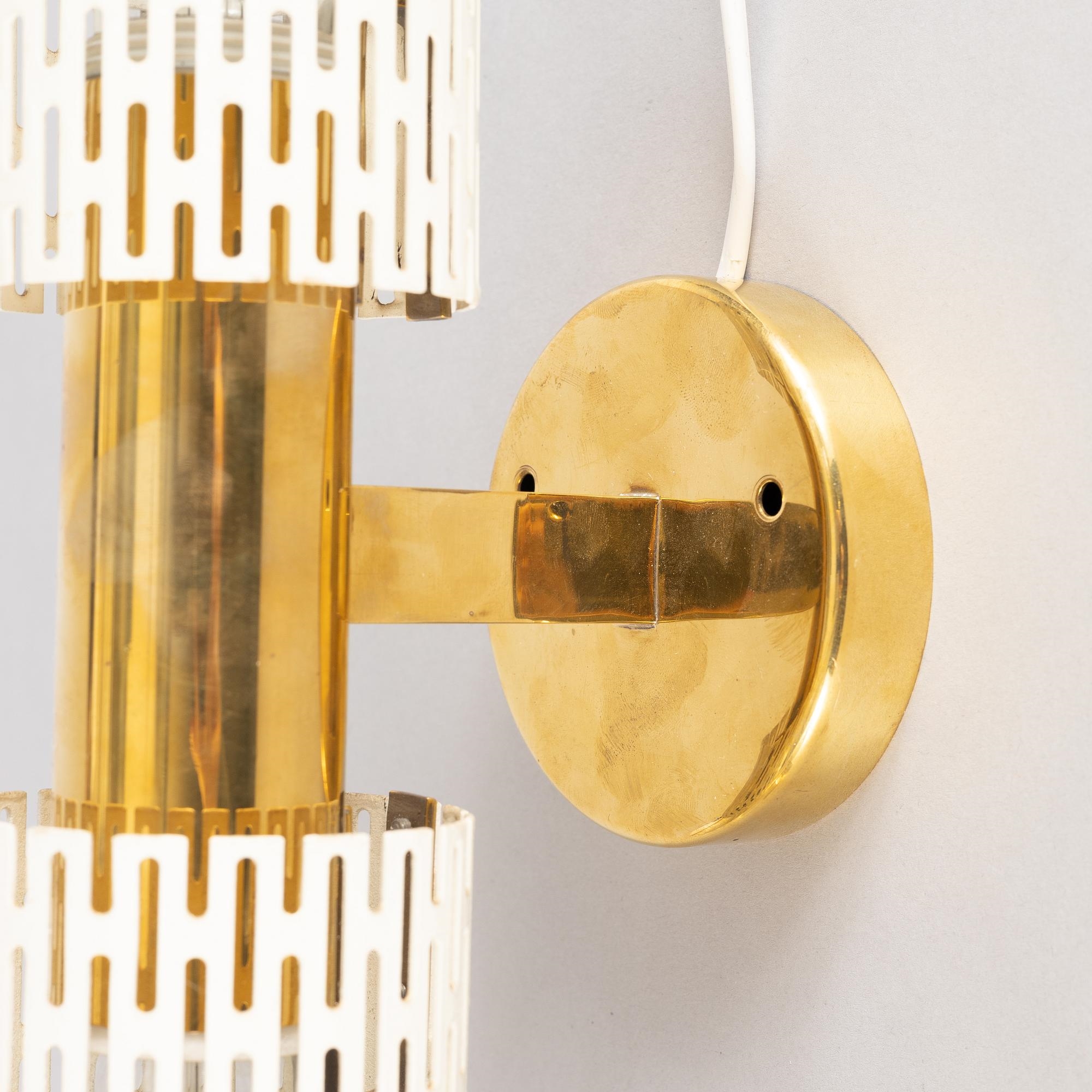 Artwork by Harald Notini, a pair of wall lamps model "8820", Arvid Böhlmarks Lampfabrik, Stockholm, 1940s-50s, Made of glass, wood and leather