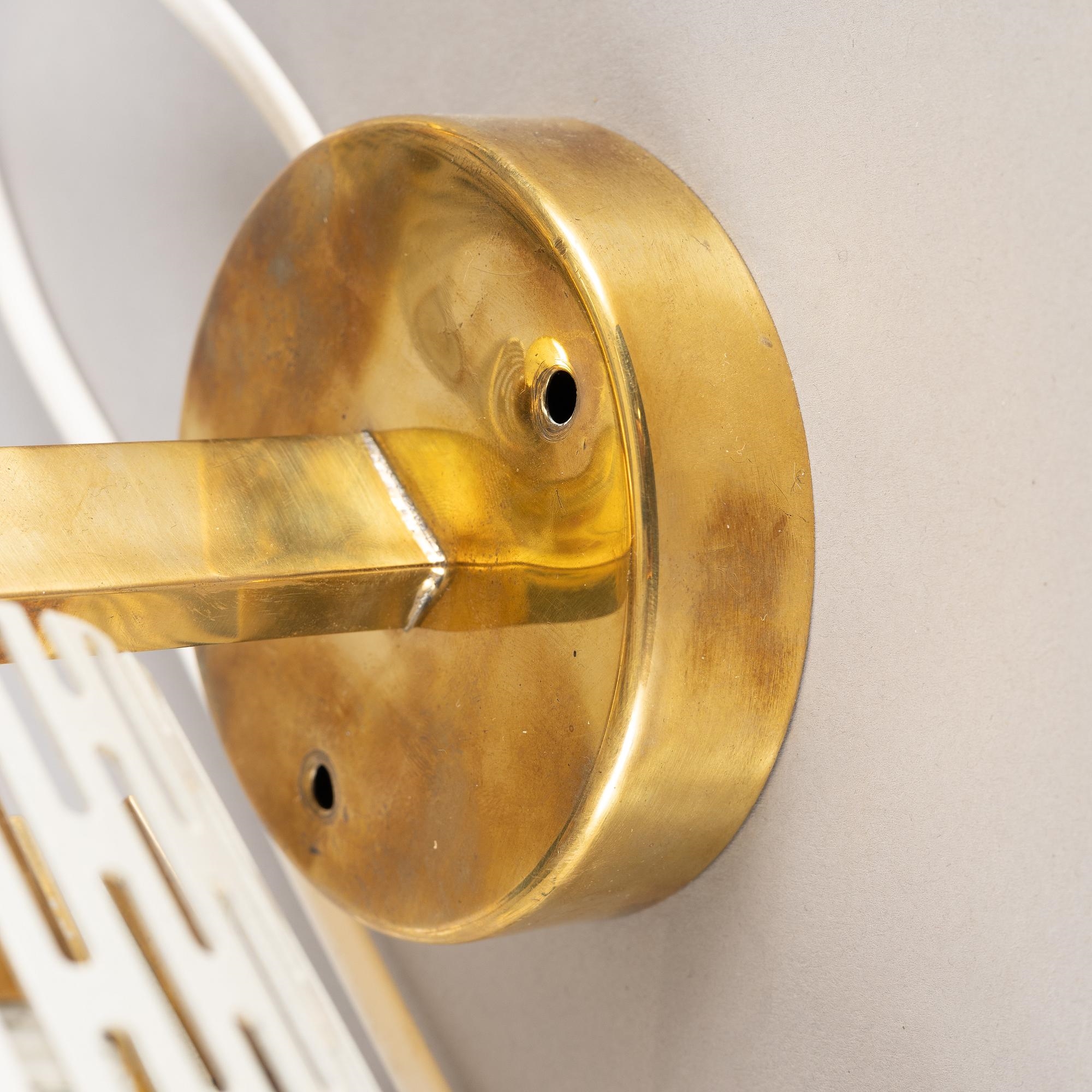 Artwork by Harald Notini, a pair of wall lamps model "8820", Arvid Böhlmarks Lampfabrik, Stockholm, 1940s-50s, Made of glass, wood and leather