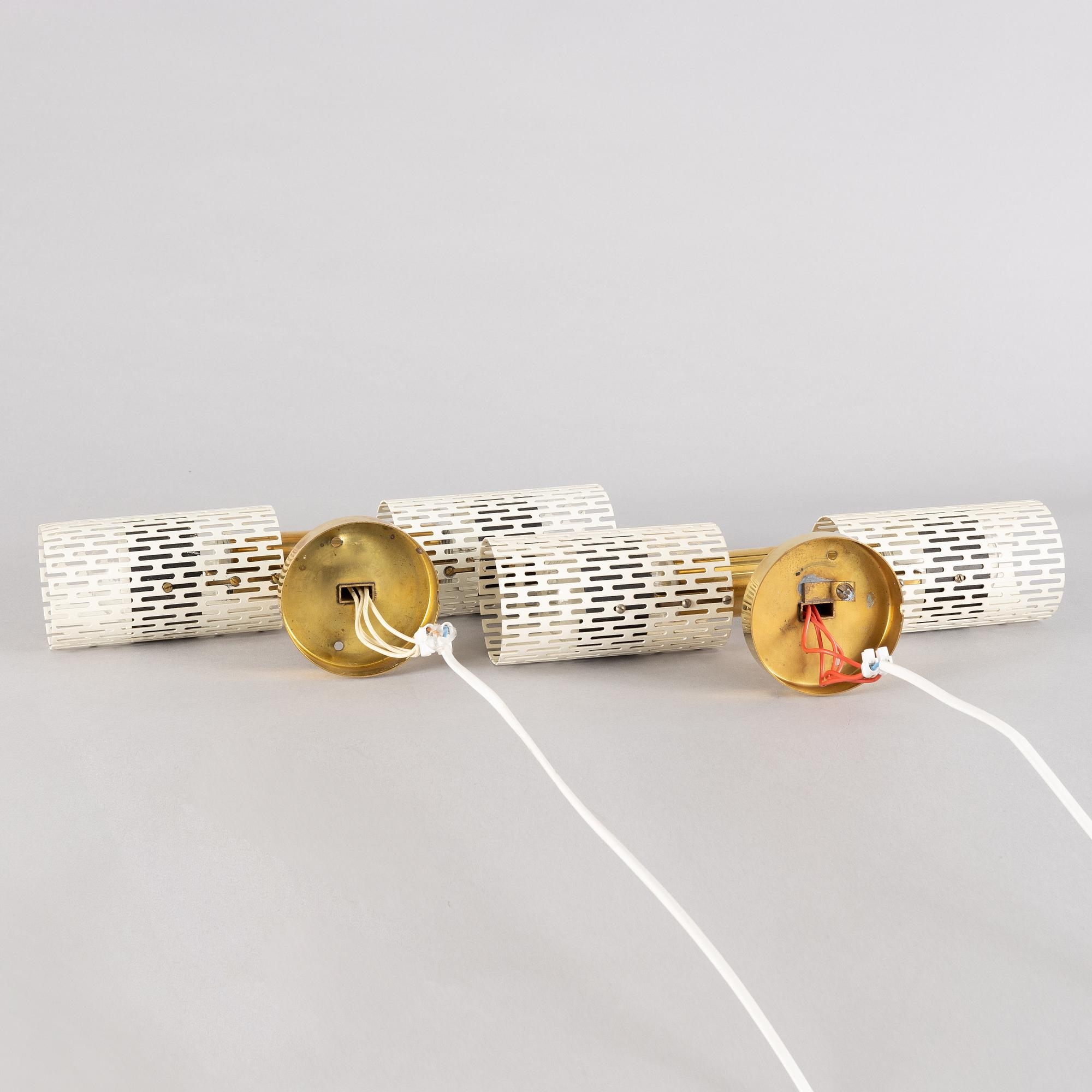 Artwork by Harald Notini, a pair of wall lamps model "8820", Arvid Böhlmarks Lampfabrik, Stockholm, 1940s-50s, Made of glass, wood and leather