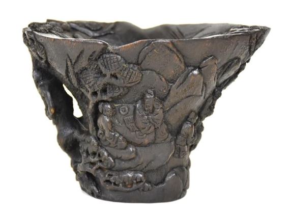 A Chinese hand carved sandalwood libation cup having all over village scene decoration by Chinese School