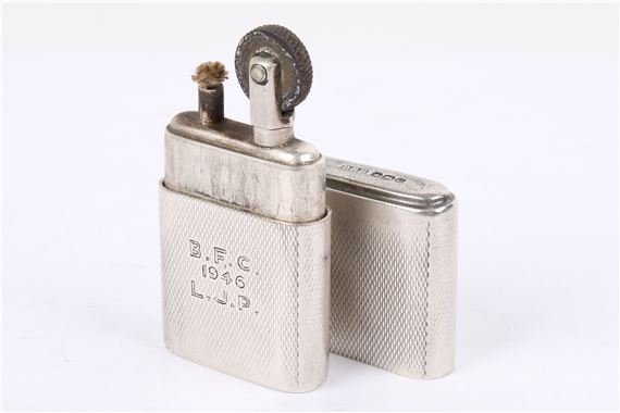 petrol cigarette lighter Unknown | A silver Howitt C16 petrol cigarette lighter. Engraved 'B.F.C.  1946 L.J (Circa 1946)