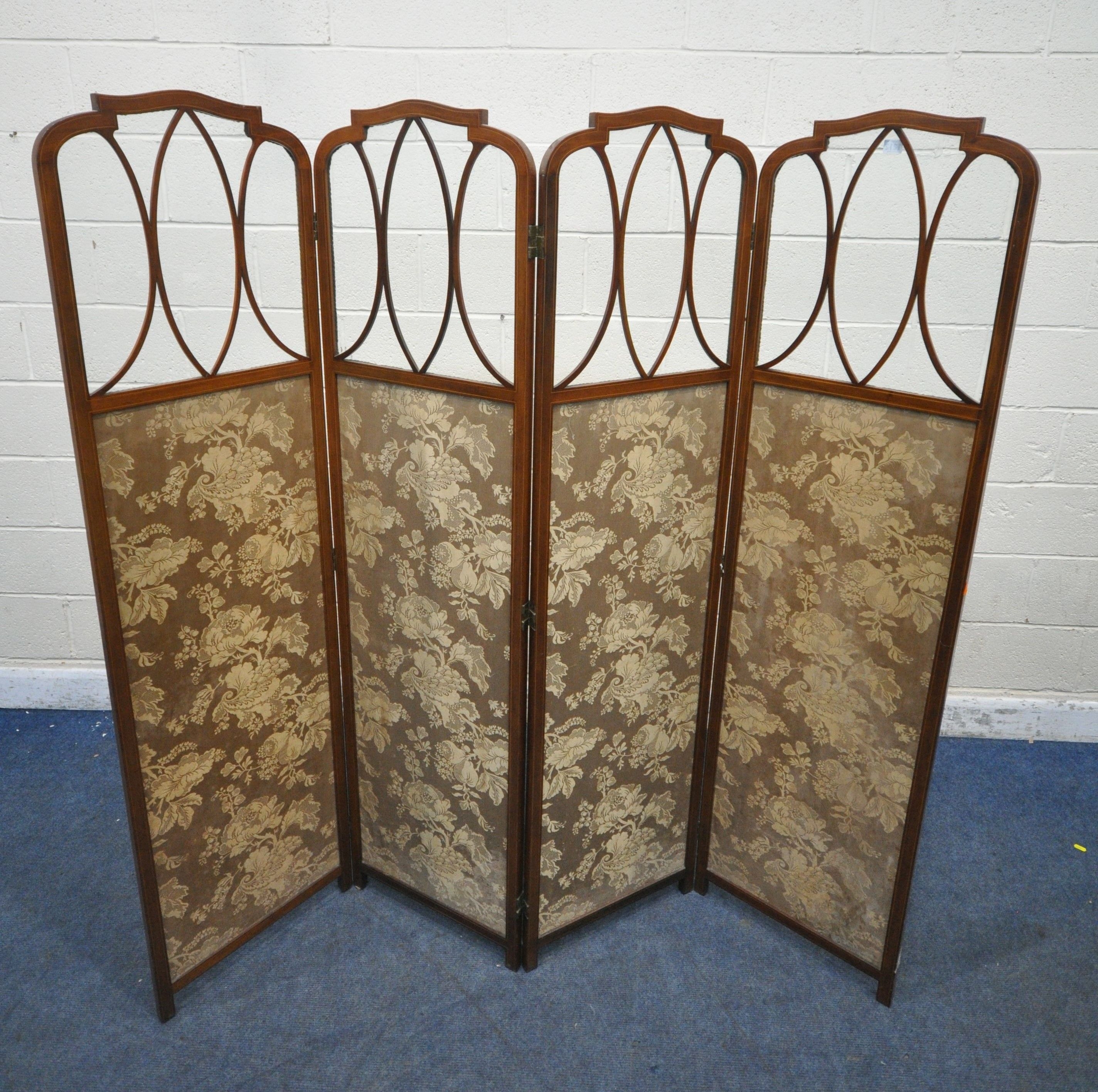 An Edwardian | AN EDWARDIAN MAHOGANY FOUR SECTION FOLDING SCREEN, with ...