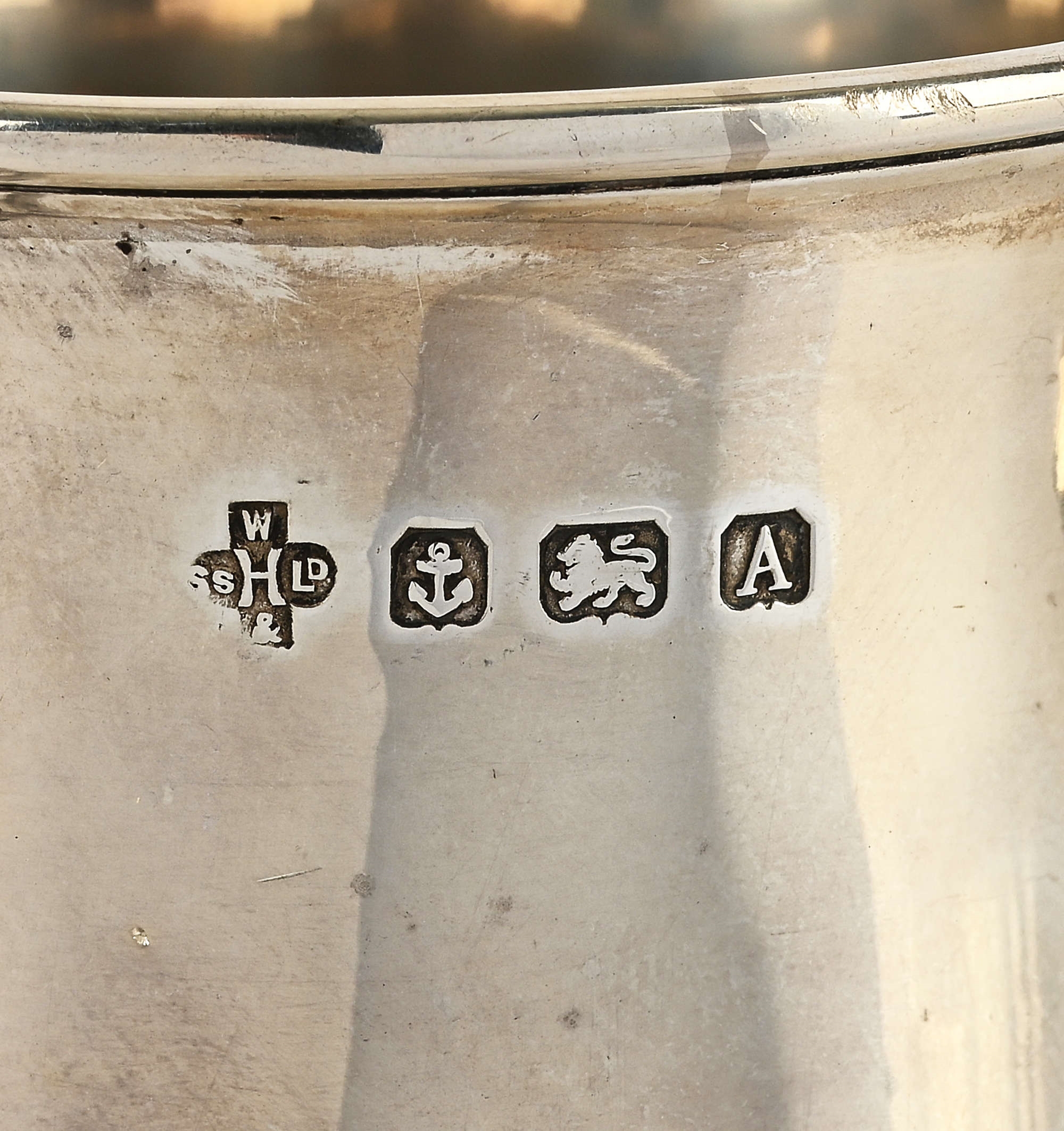 William Hutton & Sons | A silver tankard of baluster form with a scroll ...