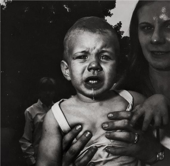 MOTHER HOLDING HR CHILD by Diane Arbus, March 14