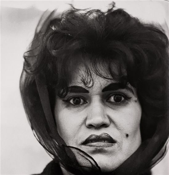 PUERTO RICAN WOMEN WITH A BEAUTY MARK by Diane Arbus, March 14