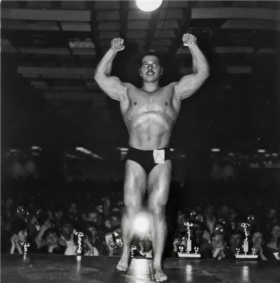 MUSCLE MAN CONTESTANT by Diane Arbus, March 14