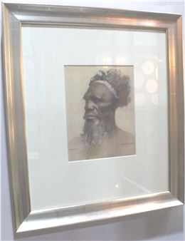 A framed charcoal portrait of a bearded figure with a headband, rendered in earthy tones.