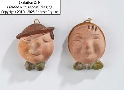 Walter Bosse, a pair of wall masks, executed in Kufstein, by 1936 or Goebel, Oeslau, by 1969 by Walter Bosse