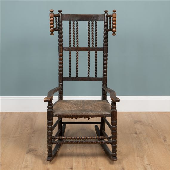 Bobbin-turned rocking chair by Ernest William Gimson