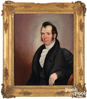 A formal portrait of a man in dark clothing and a white cravat, framed by an ornate golden border.