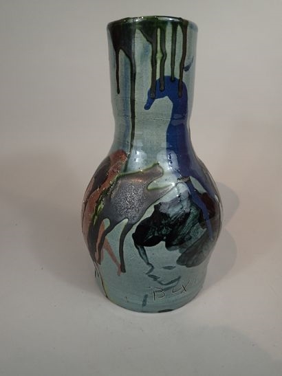 Artwork by Thomas Buxo, Thomas BUXO (XXe siècle). Grand vase en grès à décor émaillé de coulures polychromes et d'un visage féminin, Made of sandstone