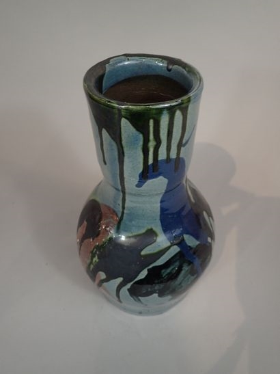 Artwork by Thomas Buxo, Thomas BUXO (XXe siècle). Grand vase en grès à décor émaillé de coulures polychromes et d'un visage féminin, Made of sandstone