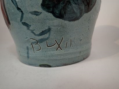 Artwork by Thomas Buxo, Thomas BUXO (XXe siècle). Grand vase en grès à décor émaillé de coulures polychromes et d'un visage féminin, Made of sandstone