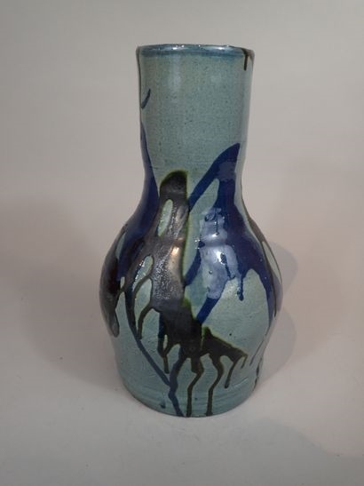 Artwork by Thomas Buxo, Thomas BUXO (XXe siècle). Grand vase en grès à décor émaillé de coulures polychromes et d'un visage féminin, Made of sandstone