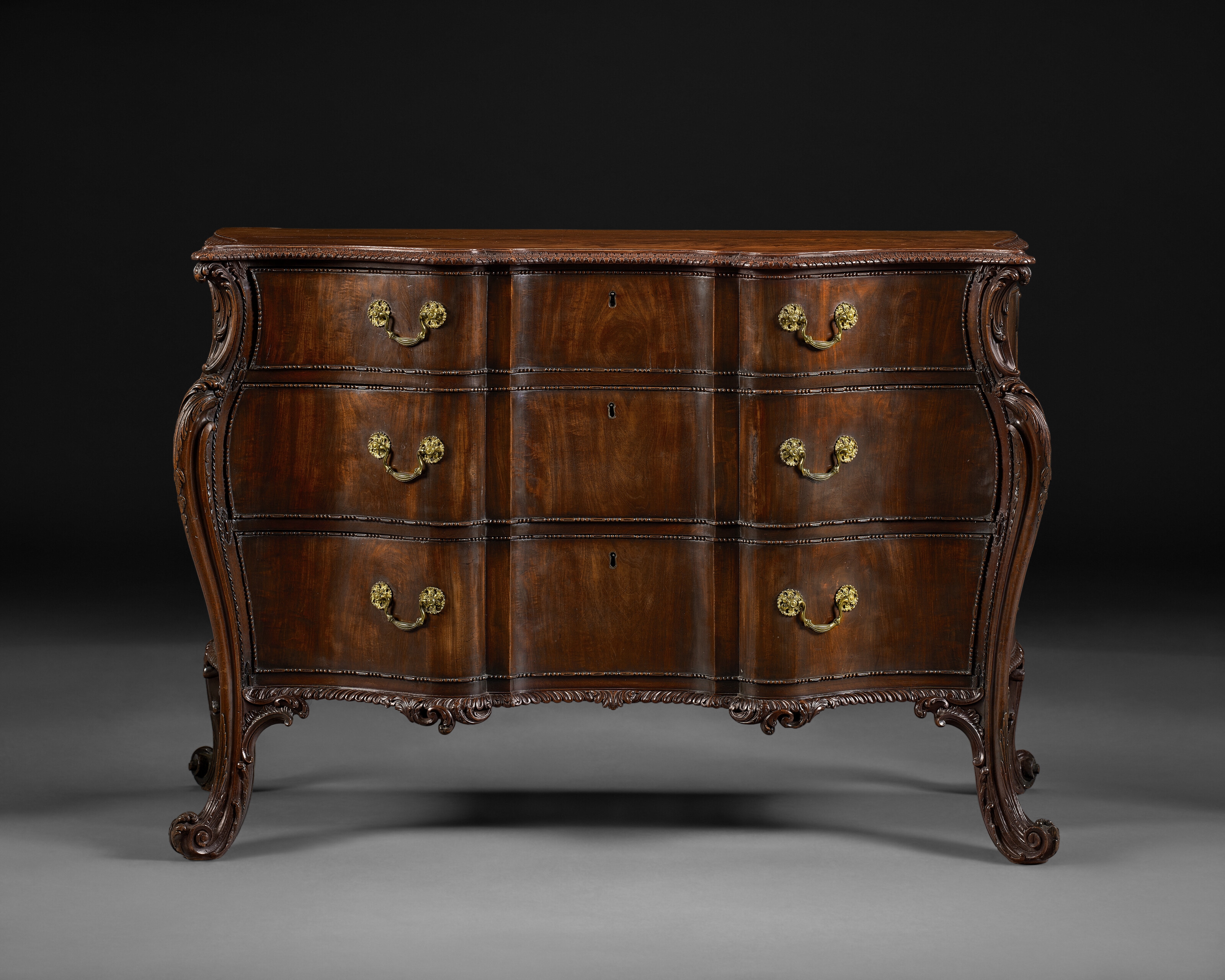 Artwork by Richard Wright, Edward Elwick, A GEORGE III MAHOGANY SERPENTINE COMMODE, Made of engraving