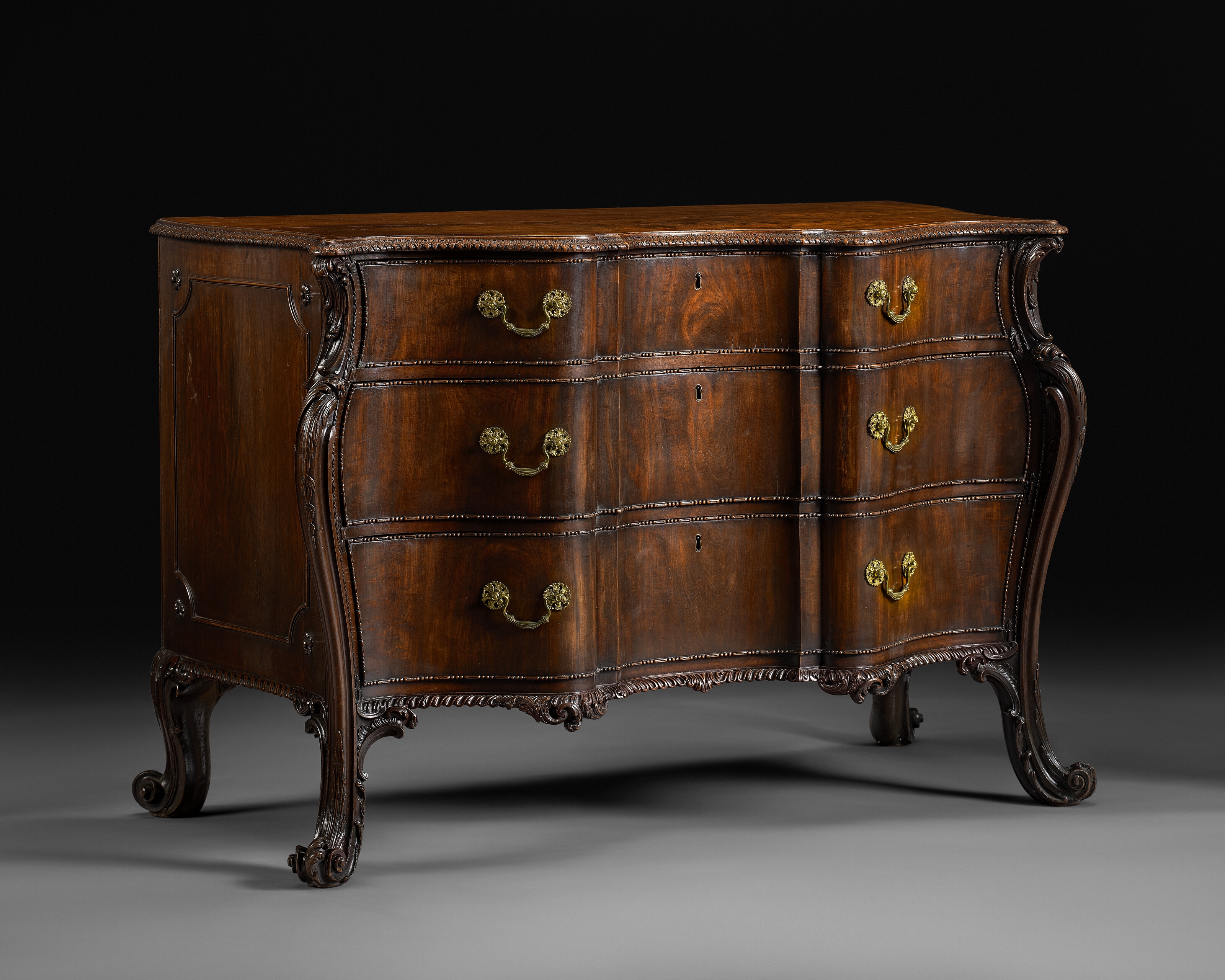 Artwork by Richard Wright, Edward Elwick, A GEORGE III MAHOGANY SERPENTINE COMMODE, Made of engraving