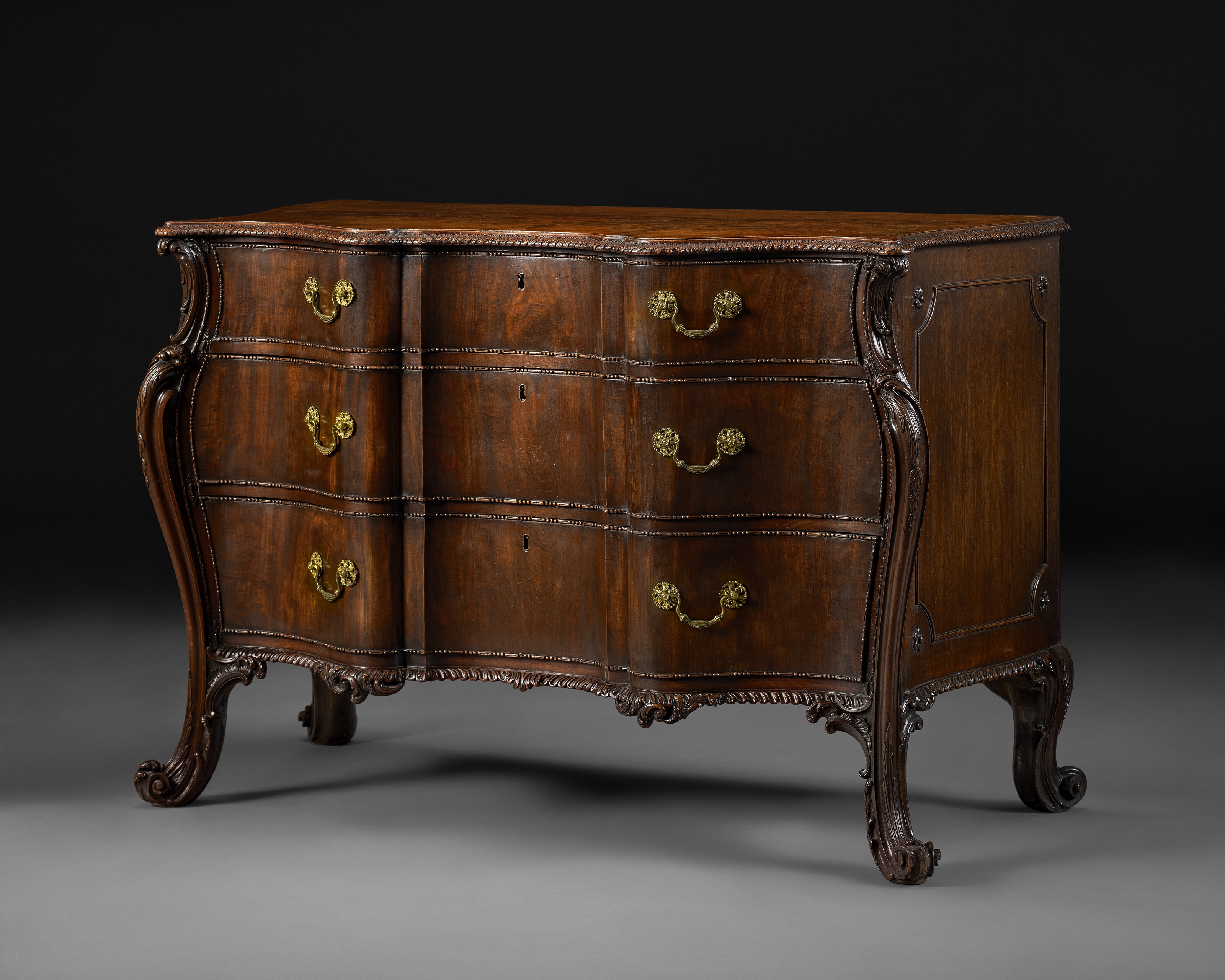 Artwork by Richard Wright, Edward Elwick, A GEORGE III MAHOGANY SERPENTINE COMMODE, Made of engraving