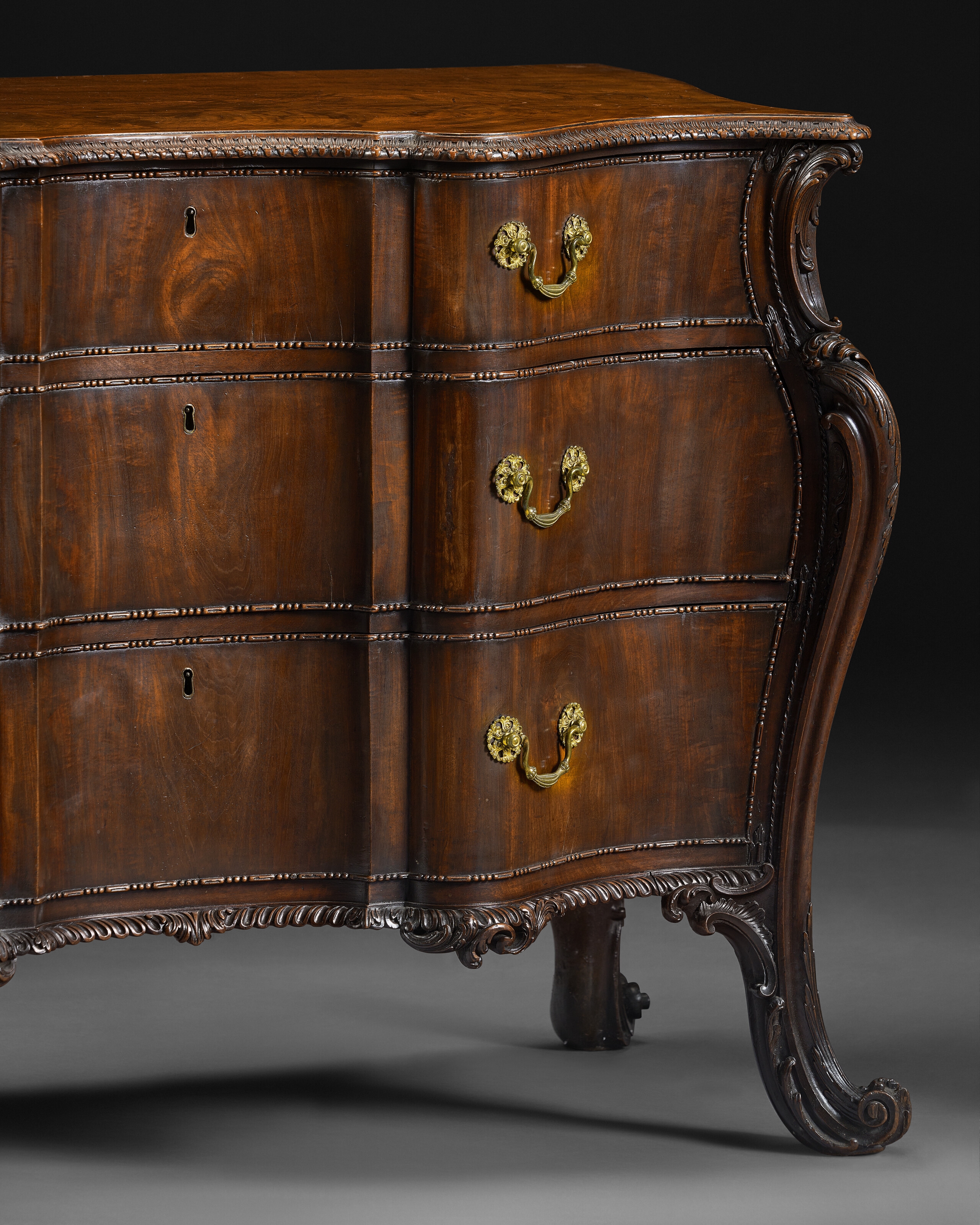 Artwork by Richard Wright, Edward Elwick, A GEORGE III MAHOGANY SERPENTINE COMMODE, Made of engraving