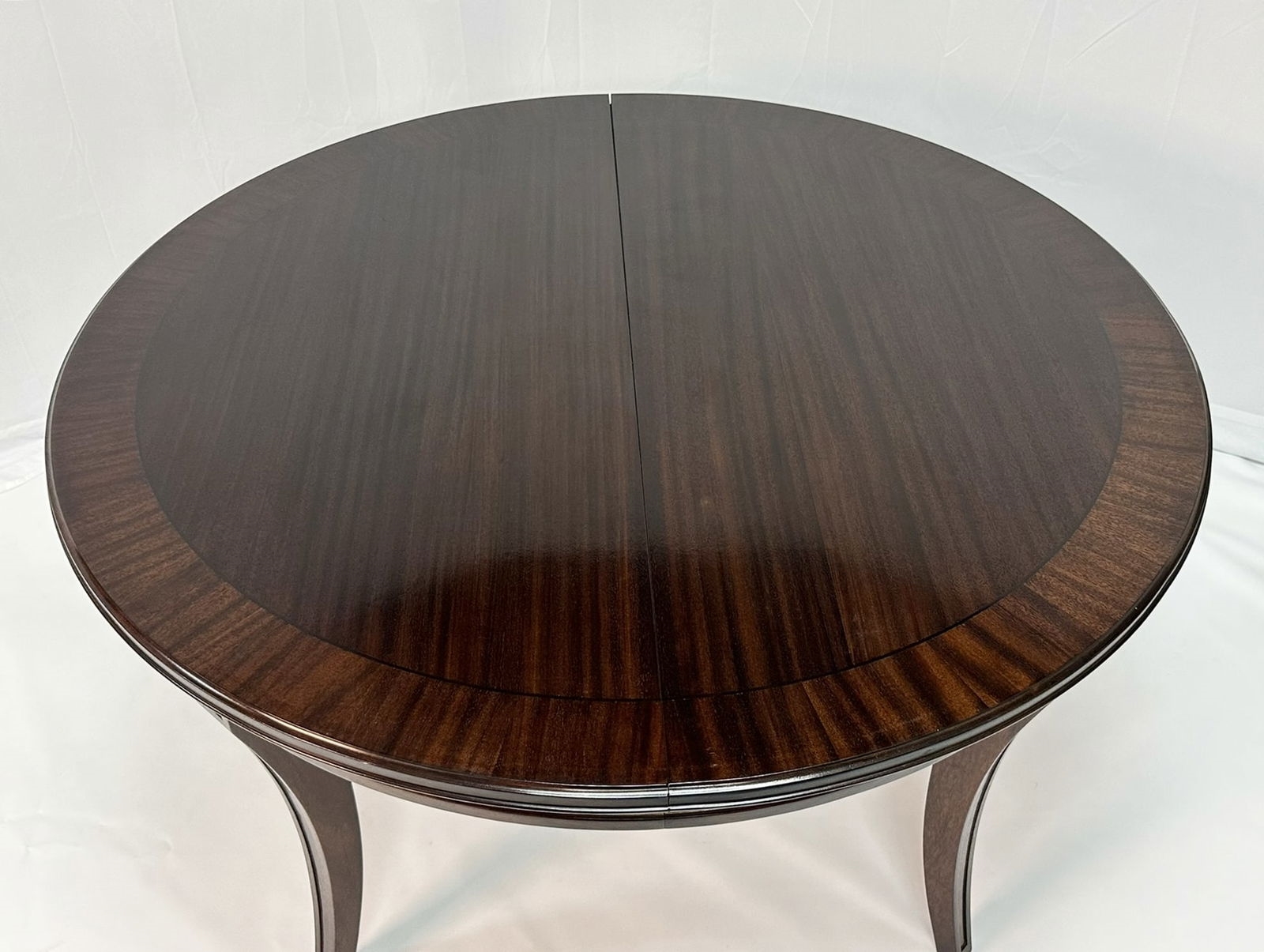 Artwork by Madeline Stuart, Talbot Dining Table, Made of mahogany and walnut wood