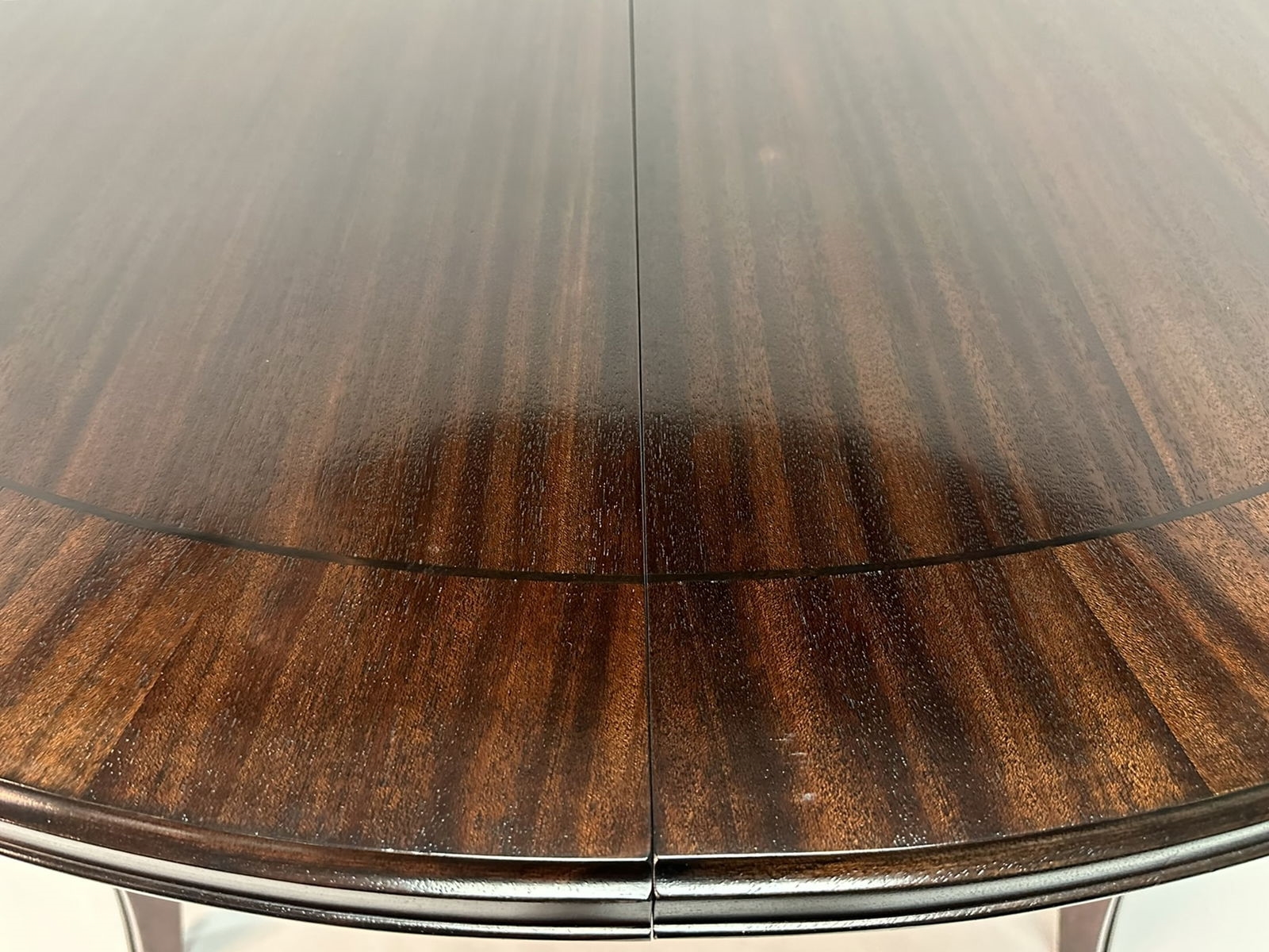 Artwork by Madeline Stuart, Talbot Dining Table, Made of mahogany and walnut wood