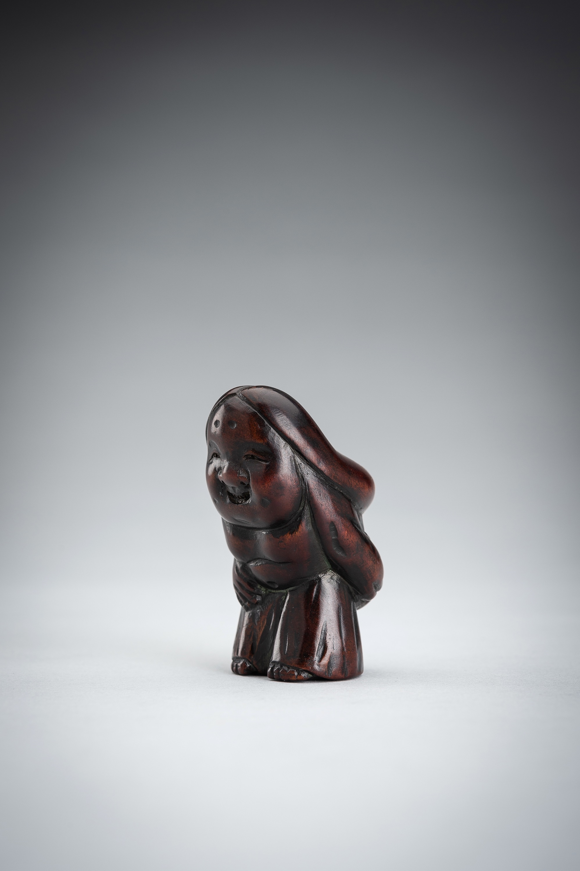 Japanese School, 19th Century | A LARGE WOOD SHUNGA NETSUKE OF OKAME ...