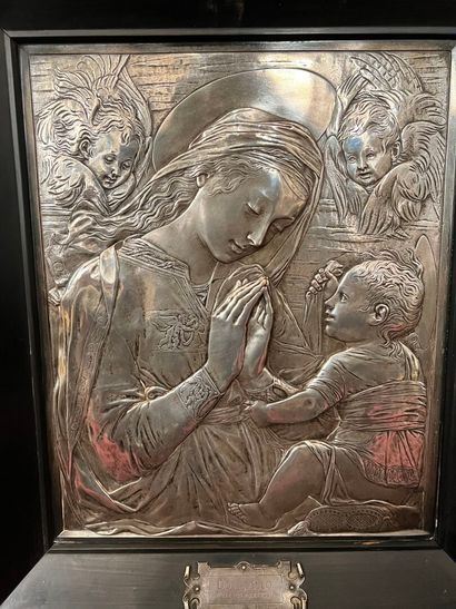 After Donatello (1386-1466)Madonna and child with a cloud of angelsSilver-plated metal plate40 x 32.5 cmFramed by Donatello