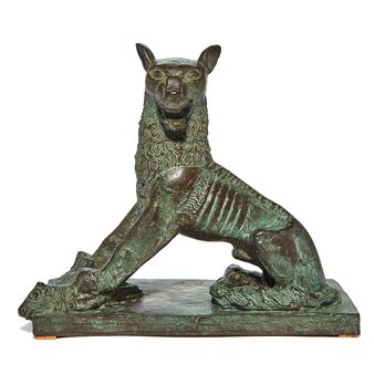 A bronze sculpture of a stylized feline figure in a dynamic pose.