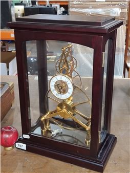 Super Star Lot : A fabulous quality day great wheel French style large skeleton clock housed in en case with a door on front and back. All  intact. In very good condition.
This is a fabulous quality clock, cant see a makers name but it's believed to be a Sinclair and Harding with a replacement pendulum - Sinclair
