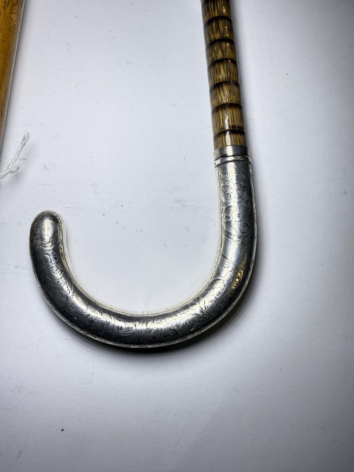 Silver | A 20th Century walking cane with engraved silver loop handle ...