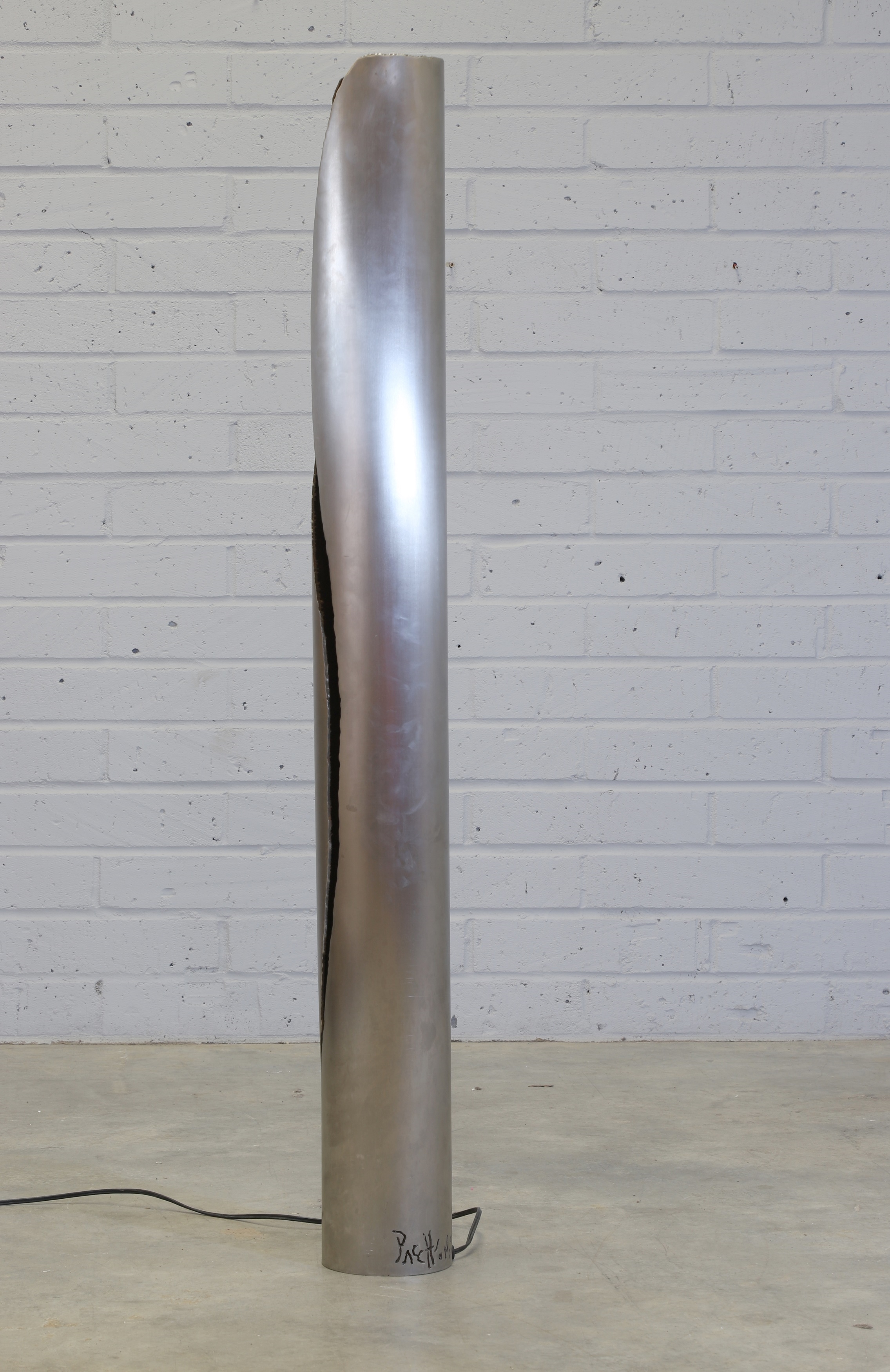 Artwork by Gianluca Pacchioni, Cut I designed in 2013 a tubular iron floor lamp to the side with an organically shaped cut, Made of tubular iron