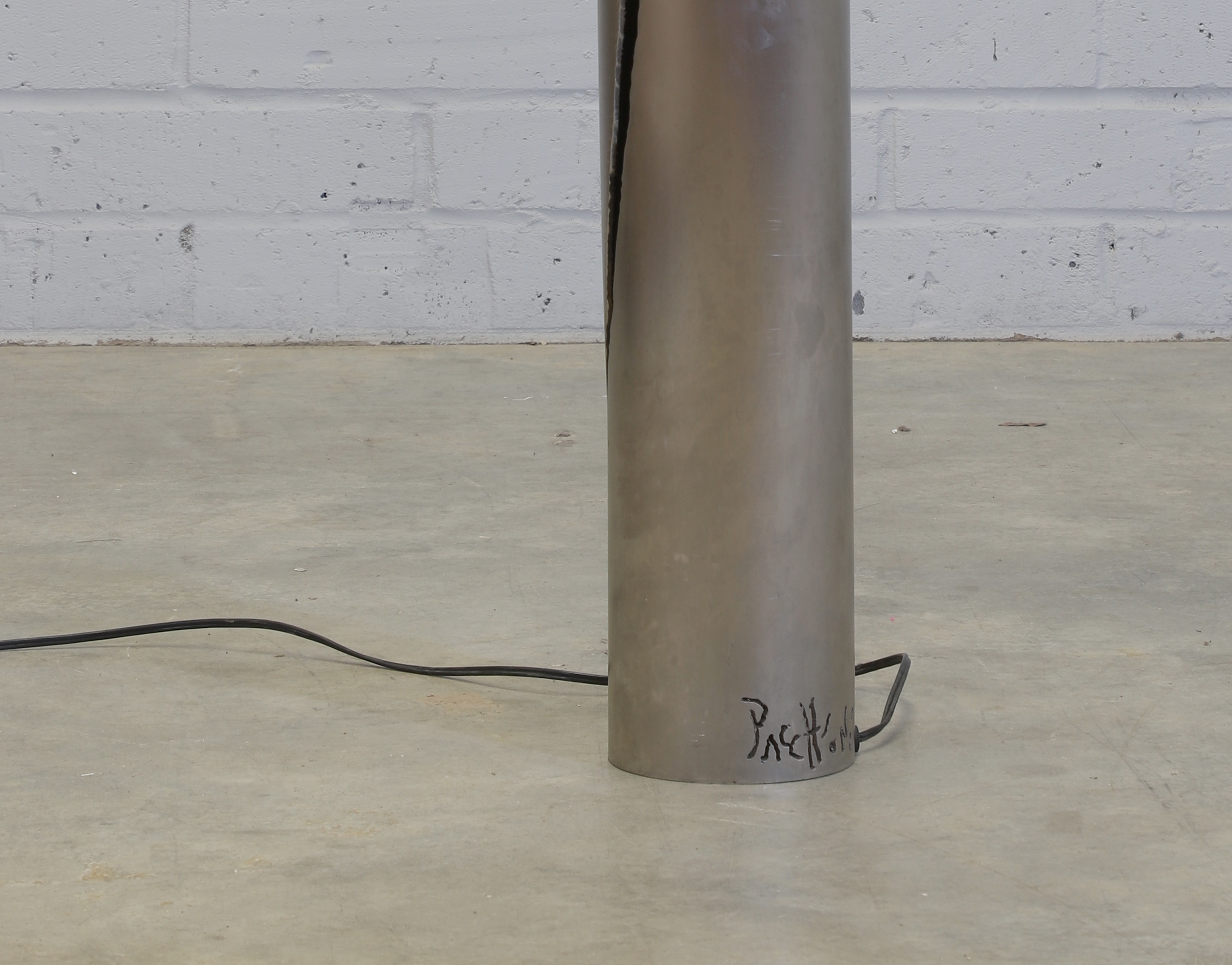 Artwork by Gianluca Pacchioni, Cut I designed in 2013 a tubular iron floor lamp to the side with an organically shaped cut, Made of tubular iron