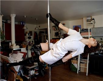 Candid Photographs of Girls Pole Dancing at Home