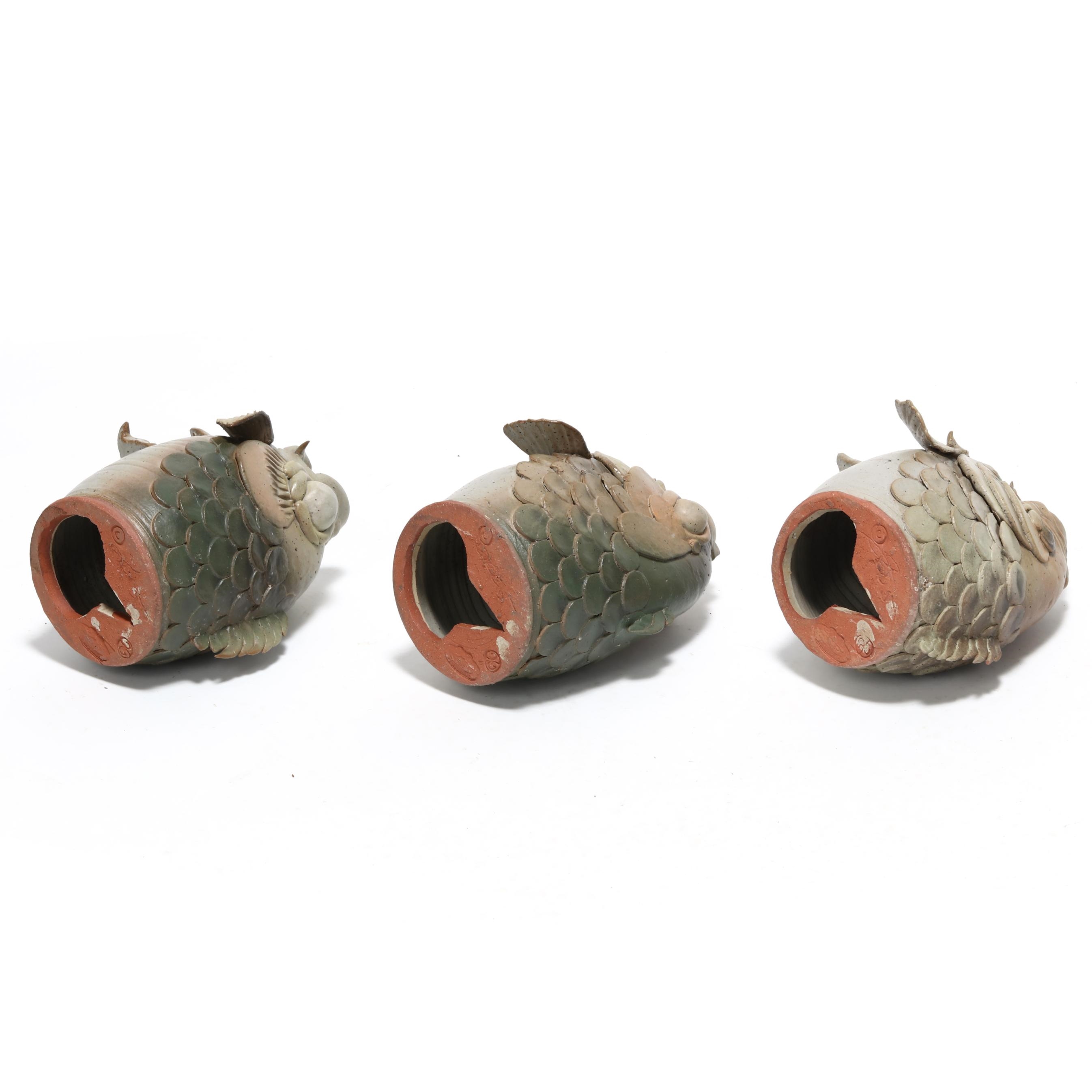 Artwork by Douglas Fey, Six Whimsical Fish Head Pottery Bird "Garglers", Made of glazed red earthenware clay