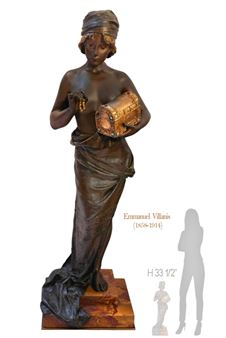 A bronze statue of a woman holding a box.