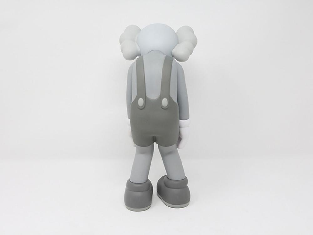Artwork by KAWS, KAWS - Small Lie (Grey, Made of vinyl