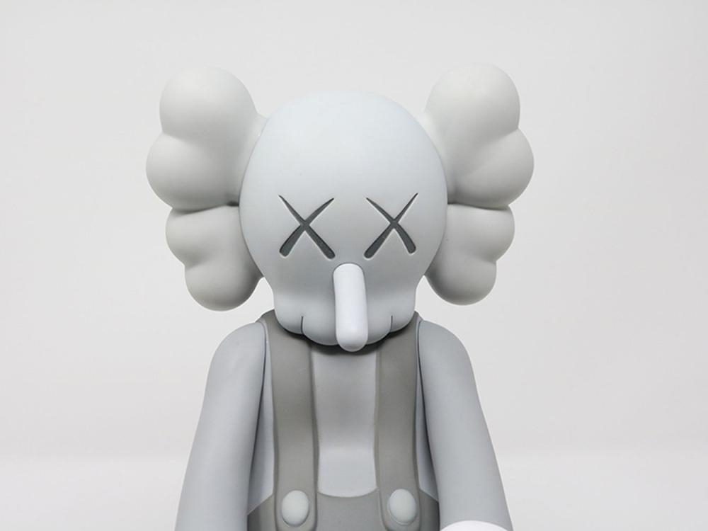 Artwork by KAWS, KAWS - Small Lie (Grey, Made of vinyl