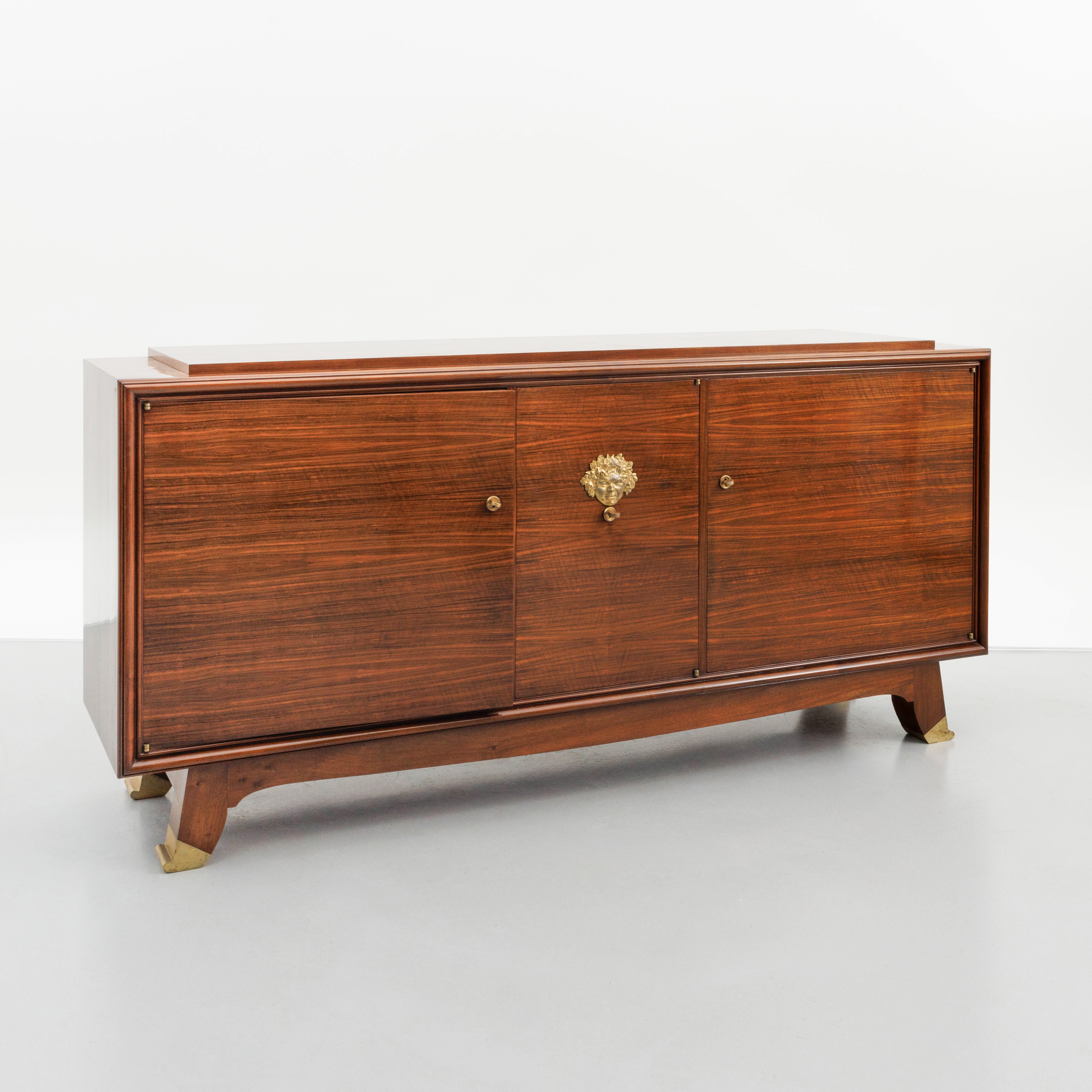 Artwork by Jules Leleu, A polished rosewood art deco-period sideboard, Made of polished rosewood