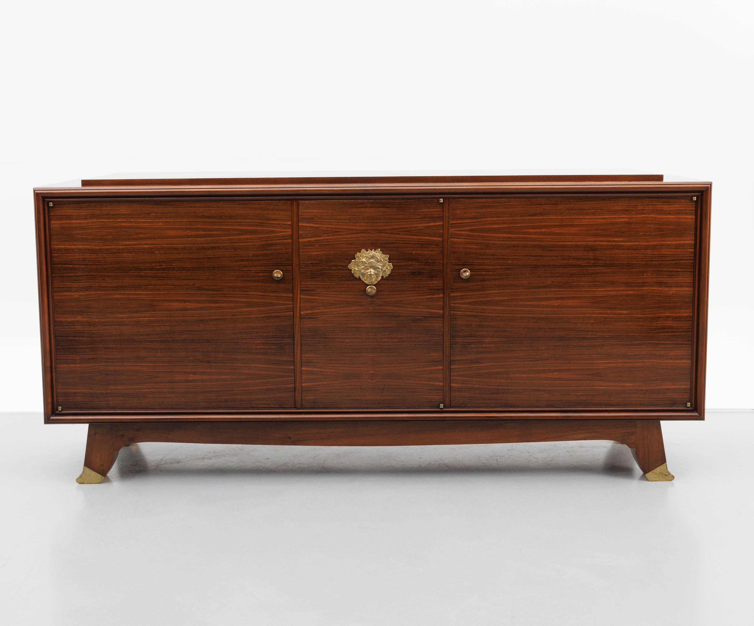 Artwork by Jules Leleu, A polished rosewood art deco-period sideboard, Made of polished rosewood