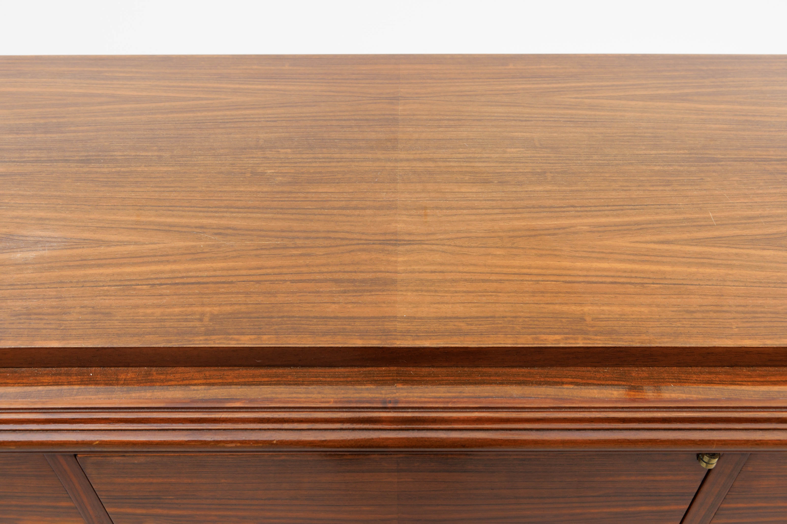 Artwork by Jules Leleu, A polished rosewood art deco-period sideboard, Made of polished rosewood