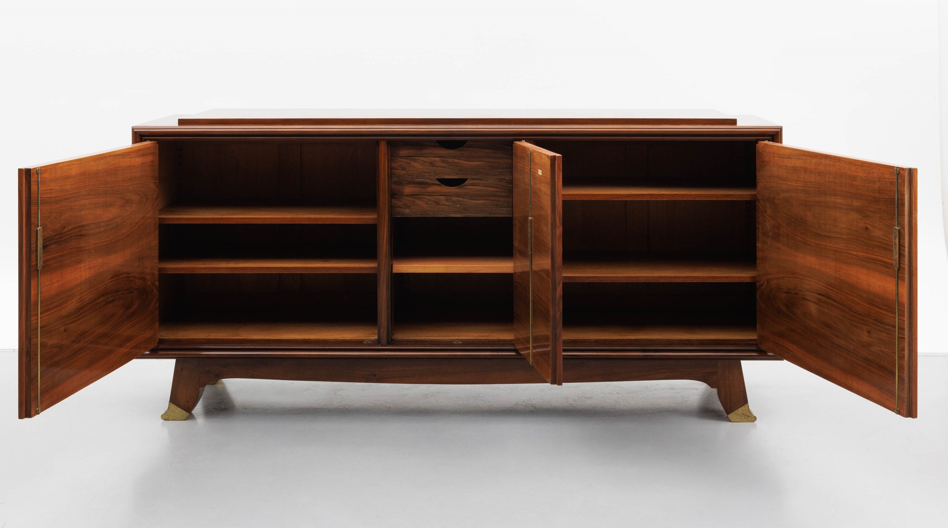Artwork by Jules Leleu, A polished rosewood art deco-period sideboard, Made of polished rosewood