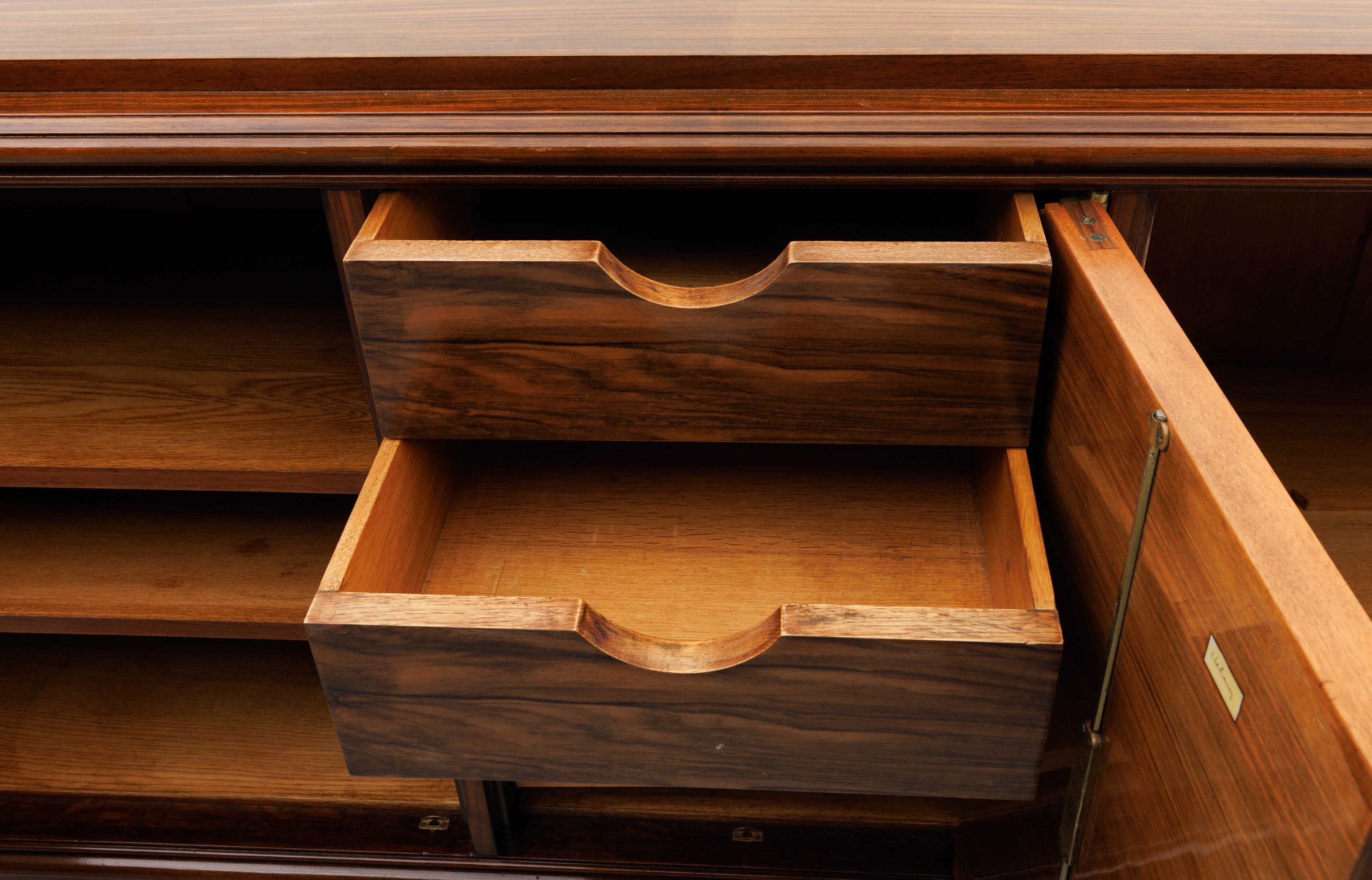 Artwork by Jules Leleu, A polished rosewood art deco-period sideboard, Made of polished rosewood
