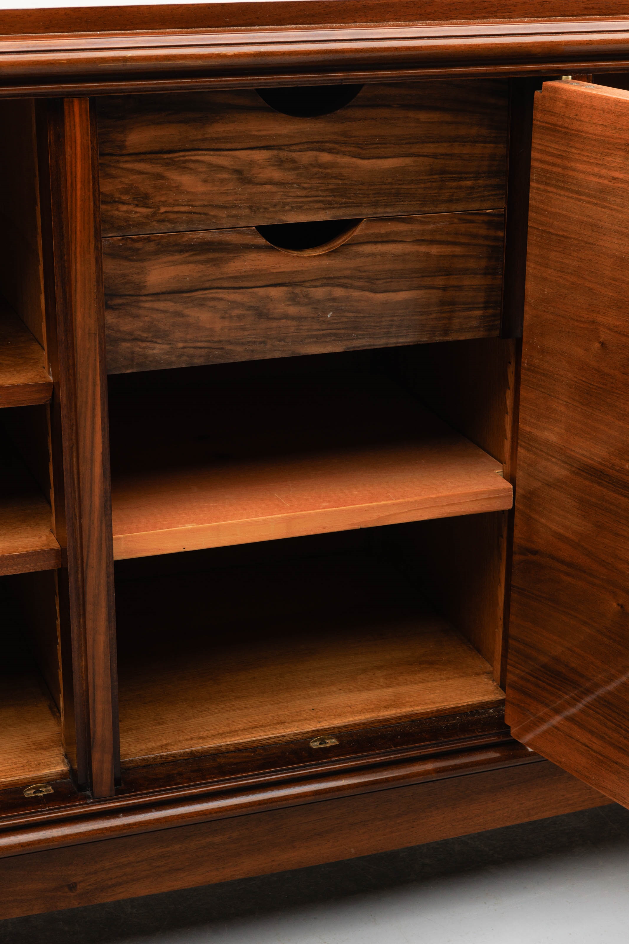 Artwork by Jules Leleu, A polished rosewood art deco-period sideboard, Made of polished rosewood