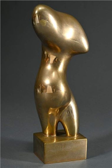 A golden abstract sculpture of a standing figure on a square base.