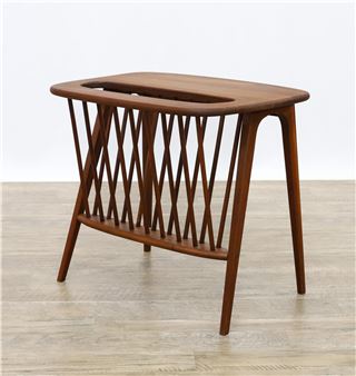 Walnut side table with flared arch supports and a built in spindle magazine rack - Arthur Uminoff