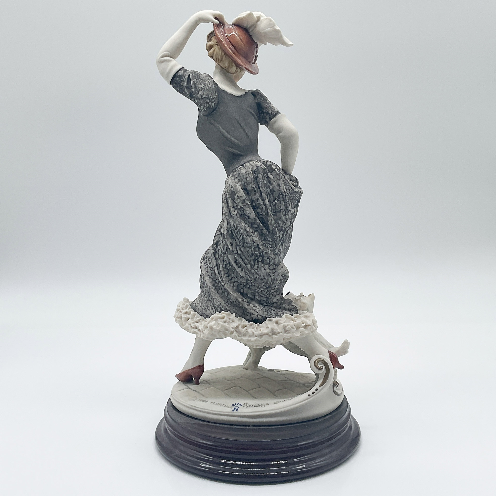 Artwork by Giuseppe Armani, Lady with Dogs, Made of porcelain figurine