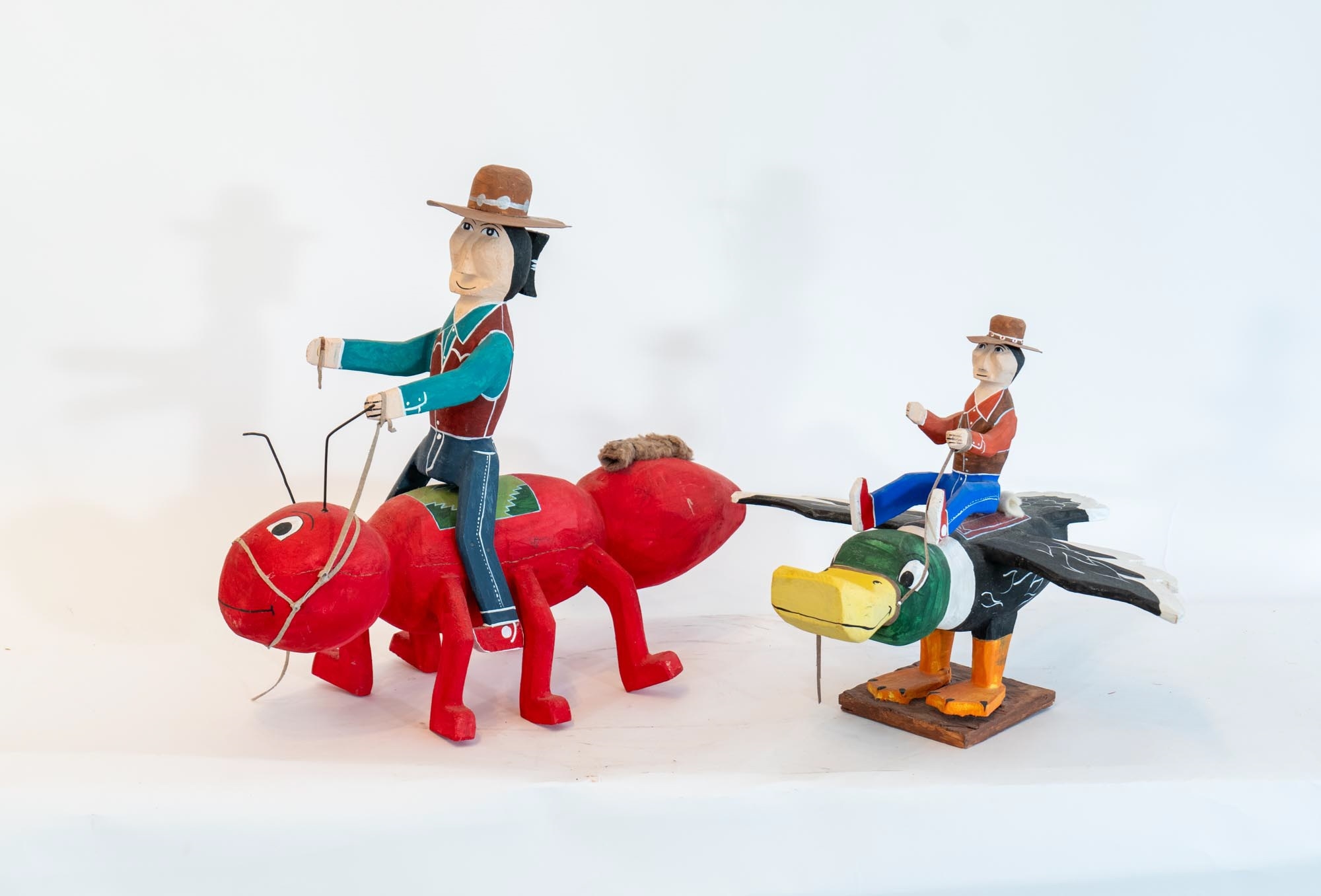 Delbert Buck | Two Navajo Painted Wood Figures | MutualArt