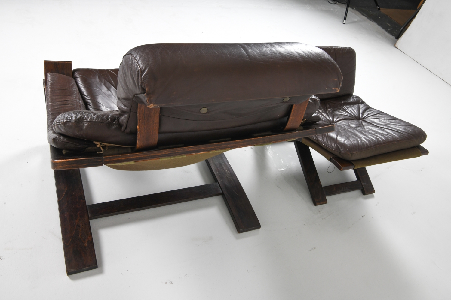 Artwork by Ake Fribyter, PAIR OF AKE FRIBYTTER LEATHER CHAIRS W/ OTTOMAN, Made of bentwood frames with leather upholstery